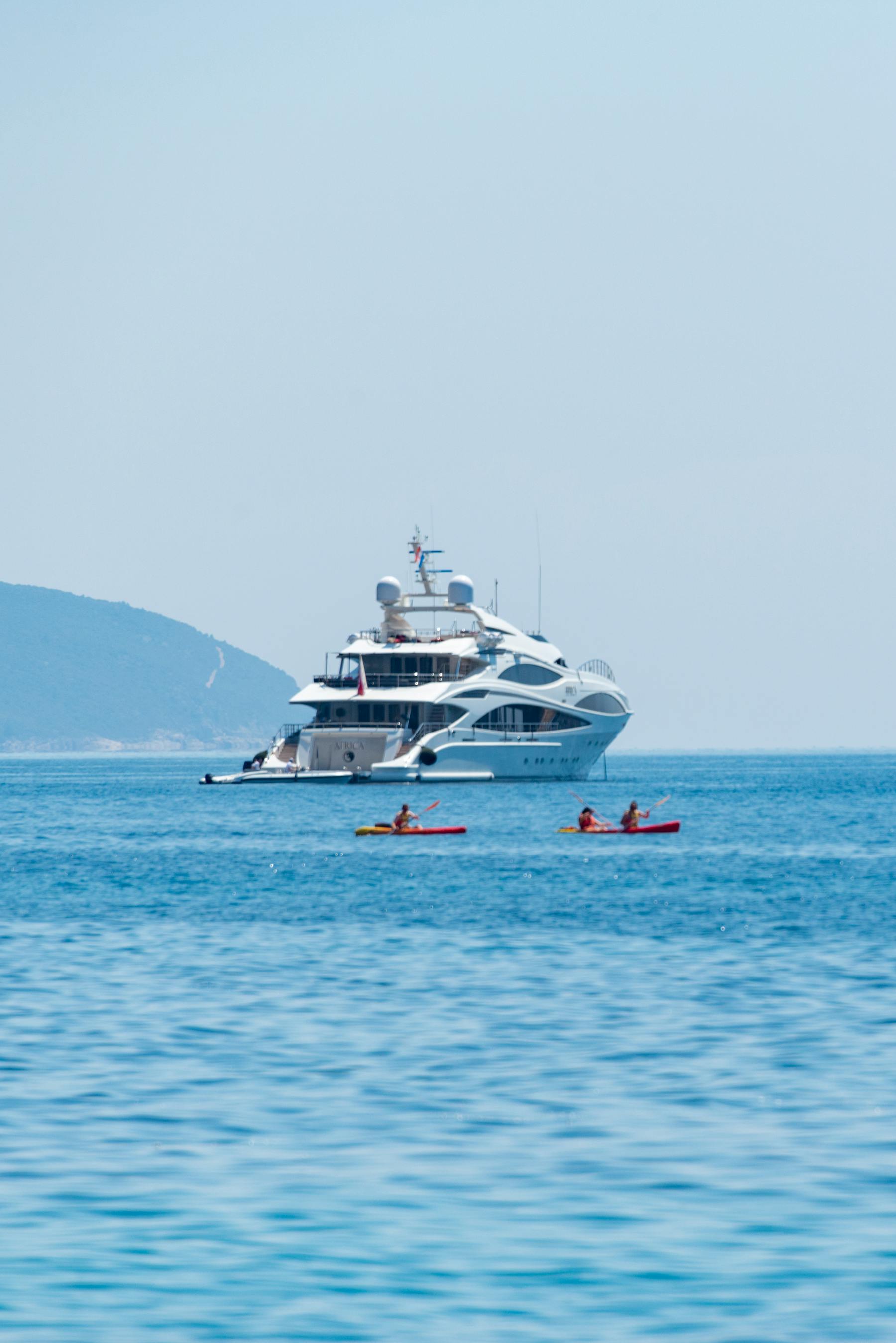 Luxury yacht underway at sea with visible communications equipment